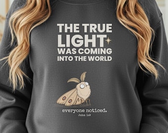 Funny Christian Christmas Sweatshirt, John 1:9 True Light Moth Crewneck, Quirky Faith Gift, Christian Christmas Gift for Men Women
