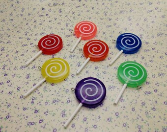 May include: Six colorful lollipop charms with a swirl design. The lollipops are red, orange, yellow, green, blue, and purple.