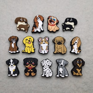 May include: A set of 14 colorful dog charms, each featuring a different breed. The charms are made of a rubber-like material and are perfect for adding a touch of personality to your belongings.