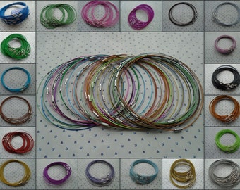 May include: A collection of 24 colorful stainless steel necklaces. The necklaces are arranged in a grid pattern, with each necklace in a different color. The colors include blue, green, purple, pink, red, orange, yellow, brown, black, and silver.