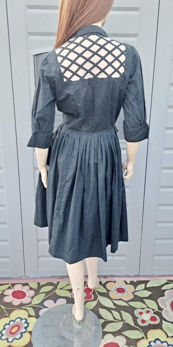 Vintage 50's  black  pleated dress with peekaboo b