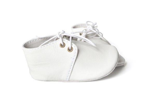 white leather baby shoes