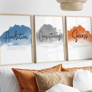 May include: Three framed motivational posters with watercolor backgrounds. The posters feature the words "Ambition", "Consistency", and "Success" with definitions below each word.