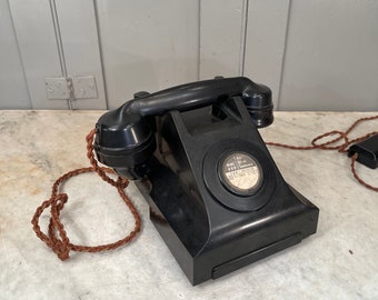 Teléfono interior antiguo de baquelita negra