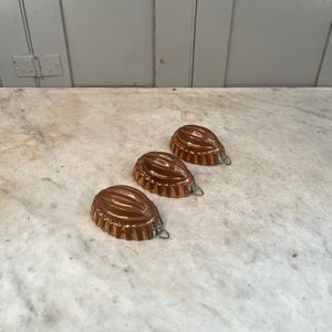 Set of 3 antique copper miniature pudding moulds