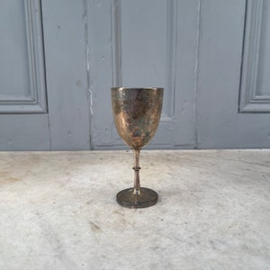 Pequeño trofeo antiguo plateado de Interbanks Junior Four con fecha de 1914