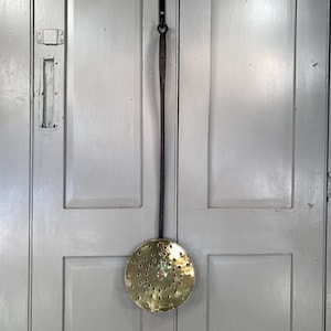 Antique Victorian brass cream skimmer or dairy spoon