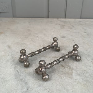 Pair antique silver plated knife rests