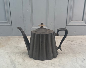 Antique pewter teapot