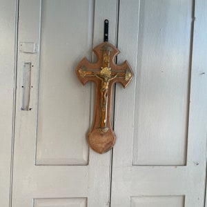 Antique French Gothic crucifix on wooden plaque