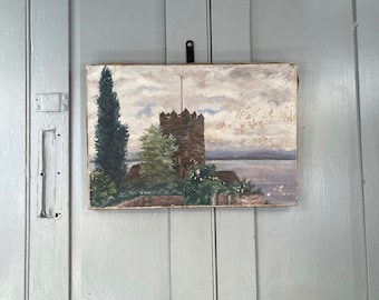 Antique French landscape oil painting of castle battlement and lake