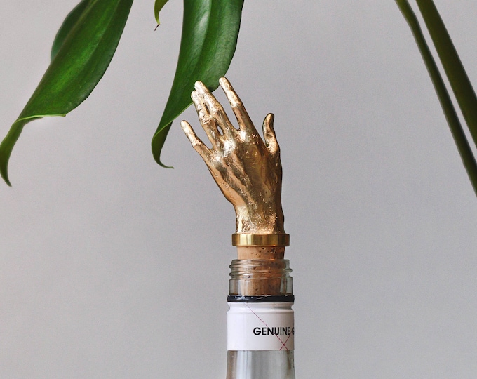 Bottle Stopper Hand. Wine Bottle stopper gold color. Golden Bottle cork