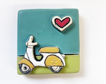 clique tile - white and tan scooter