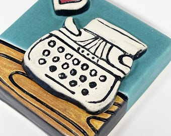 clique tile - typewriter on the table