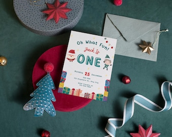 May include: A Christmas-themed first birthday party invitation with a red and green color scheme. The invitation features a cartoon Santa Claus and an elf, along with the text "Oh What Fun! Jack is One". The invitation also includes the date and time of the party, as well as the address.