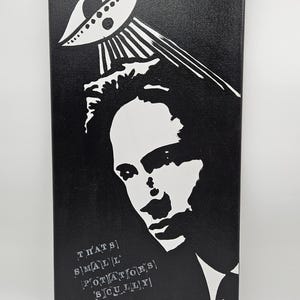 May include: Black and white canvas art featuring a stylized portrait and an alien-like design. The text on the canvas reads "THAT'S SMALL POTATOES SCULLY". The canvas measures 12x24 inches.