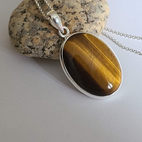 Tiger eye pendant, oval, set in 92.5 sterling silver, sterling chain option