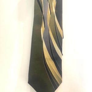 May include: A necktie featuring a dark olive green base color with a series of vertical, flowing abstract waves in shades of light yellow, muted grey, and deep charcoal. The pattern consists of smooth, elongated curves that run along the length.