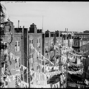Photo of New York tenement yard filled with hanging laundry