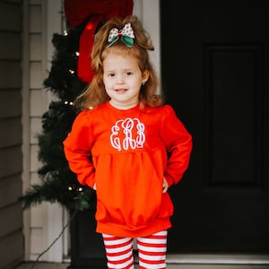 orange monogram sweater