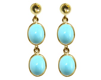 May include: A pair of gold earrings with two oval turquoise stones on each earring.