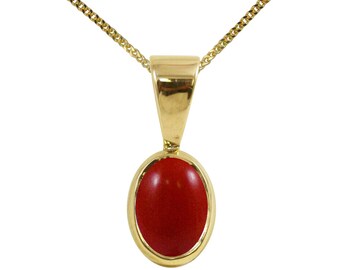 Può includere: Una collana con ciondolo in oro e una pietra di corallo rosso ovale.
