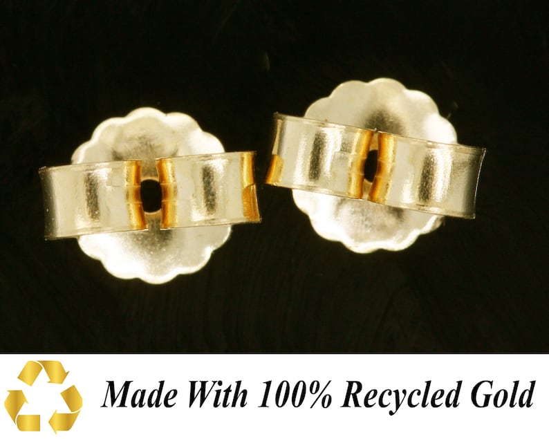 May include: Two gold-toned earring backs, made with 100% recycled gold. The backs are designed to secure earrings in place.