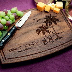Handmade from natural hardwood personalized cutting board. Never stained, 100% food safe, only finished with food grade mineral oil and beeswax. 12x9 inches Walnut Arched Wooden board with palm trees and beach chairs design number 409.