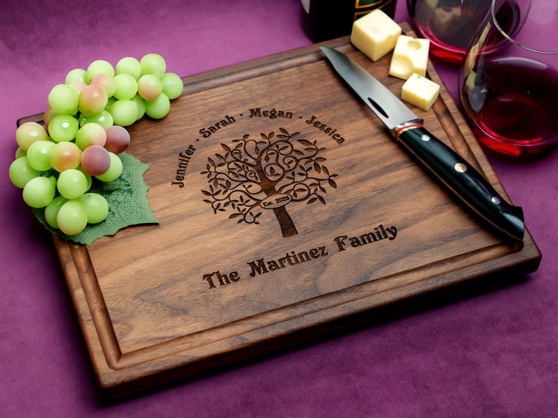 Handmade from natural hardwood personalized cutting board. Never stained, 100% food safe, only finished with food grade mineral oil and beeswax. 12x9 inches Walnut Wooden board with Family Tree design 402 with first names, date, and family name.