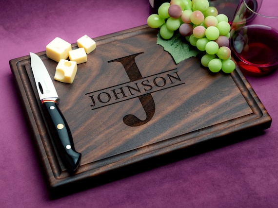 Personalized walnut monogram cutting board with 1,550+ favorites signals this is a proven crowd-pleaser for weddings and housewarmings.