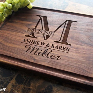 Handmade from natural hardwood personalized cutting board.Never stained, 100% food safe, only finished with food grade mineral oil and beeswax.12x9 inches Walnut Wooden board with central design number 003 with initial,date,first names,and last name.