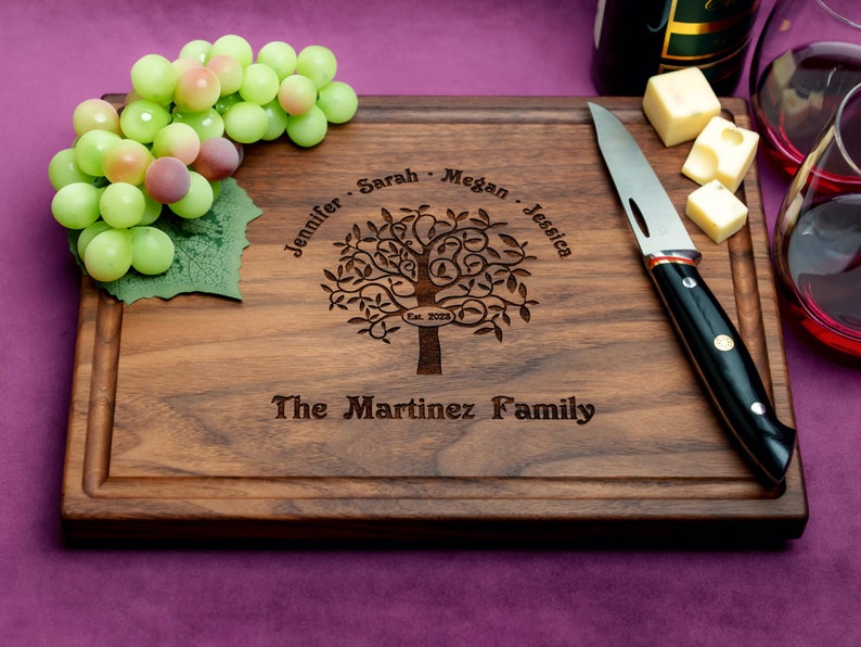 Handmade from natural hardwood personalized cutting board. Never stained, 100% food safe, only finished with food grade mineral oil and beeswax. 12x9 inches Walnut Wooden board with Family Tree design 402 with first names, date, and family name.