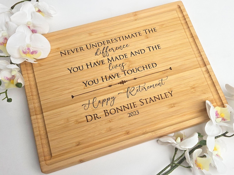 Bamboo cutting board engraved with retirement design. Perfect corporate gift for colleagues .