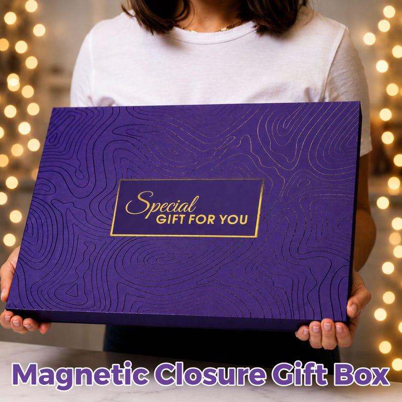 May include: A rectangular purple gift box with a magnetic closure, featuring a debossed topographic line pattern across the surface. A central gold rectangular label displays the text Special GIFT FOR YOU in elegant gold lettering.