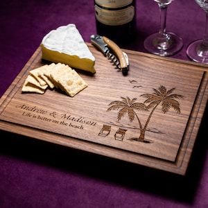 Handmade from natural hardwood personalized cutting board. Never stained, 100% food safe, only finished with food grade mineral oil and beeswax. 12x9 inches Walnut Wooden board with palm trees and beach chairs design number 409.