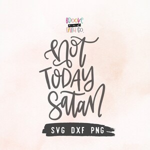 May include: A digital download of a black and white graphic design with the text "Not Today Satan" in a handwritten style. The design also includes the text "Brooke and Faith Co." and "SVG DXF PNG".