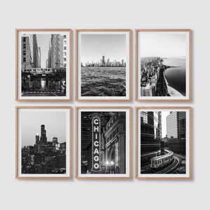 May include: Six black and white photographs of Chicago, Illinois, framed in natural wood. The photos show various cityscapes, including the Chicago River, the Chicago skyline, and the Chicago Theatre.