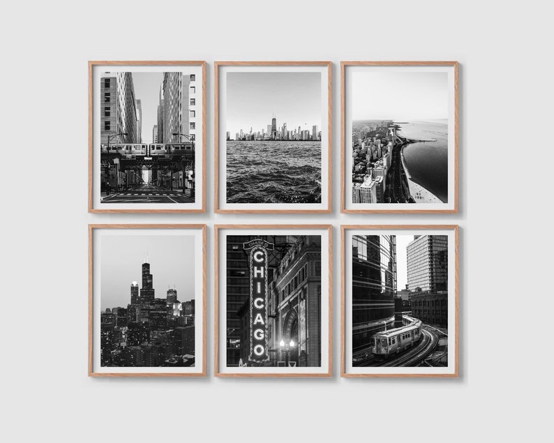May include: Six black and white photographs of Chicago, Illinois, framed in natural wood. The photos show various cityscapes, including the Chicago River, the Chicago skyline, and the Chicago Theatre.