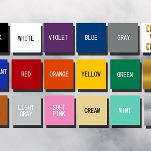 Peut inclure: Une grille d'&eacute;chantillons de couleurs avec des &eacute;tiquettes textuelles. Les couleurs comprennent le noir, le blanc, le violet, le bleu, le gris, le bleu brillant, le rouge, l'orange, le jaune, le vert, l'or, le brun noisette, le gris clair, le rose tendre, la cr&egrave;me, la menthe et l'argent. Le texte "CHOOSE YOUR COLOUR" est &eacute;galement pr&eacute;sent.
