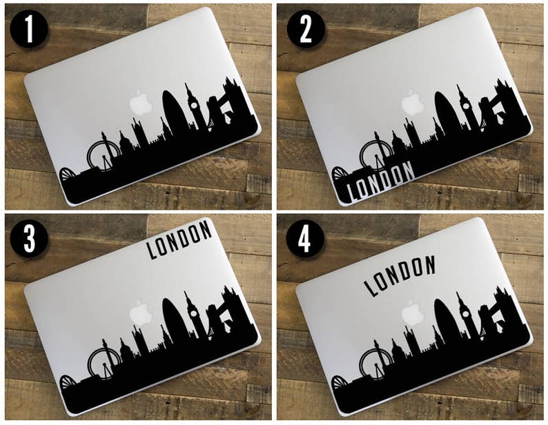 Peut inclure: Un ordinateur portable argent&eacute; avec un autocollant noir repr&eacute;sentant la silhouette de Londres. Le design comprend le London Eye, Big Ben et le Tower Bridge. Le mot "LONDON" est imprim&eacute; en noir sur certains ordinateurs.