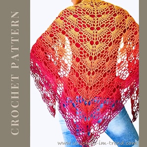May include: A handmade crochet shawl in a gradient of colours, transitioning from gold to red. The shawl features an open, lacy design with a fan-like pattern. The text "CROCHET PATTERN" is visible on the left side.