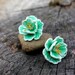 Brydie Schreindorfer, Gloved One follower reviewed Hit of the season! Mint color style sakura stud earrings, polymer clay floral jewelry