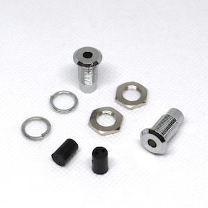 May include: Two chrome-plated metal electrical outlet covers with rubber grommets, two chrome-plated metal nuts, and two chrome-plated metal washers.