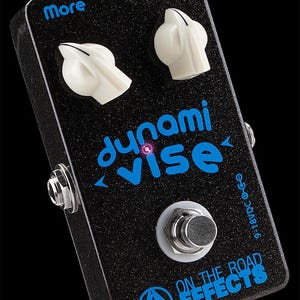 May include: A black guitar effects pedal with a blue and white logo that says "Dynami Vise". The pedal has two knobs labeled "Smooosh" and "More" and a footswitch. The text "9-18VDC" is printed on the side of the pedal. The pedal is made by On The Road Effects.