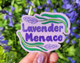 May include: A purple sticker with green stems and lavender flowers. The sticker says "Lavender Menace" in purple text.