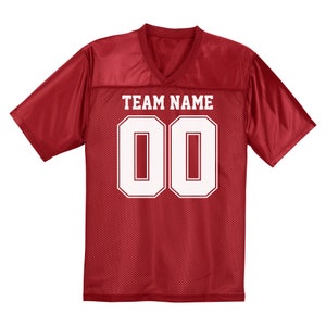 Puede incluir: Camiseta de f&uacute;tbol roja con malla blanca y un n&uacute;mero blanco "00" y el texto "TEAM NAME" en la parte delantera.