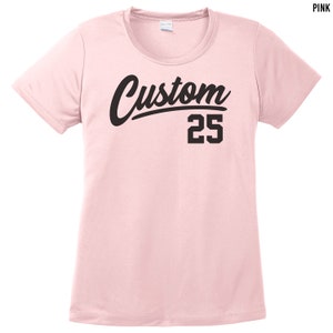 May include: Pink short-sleeved t-shirt with black text that says "Custom 25".