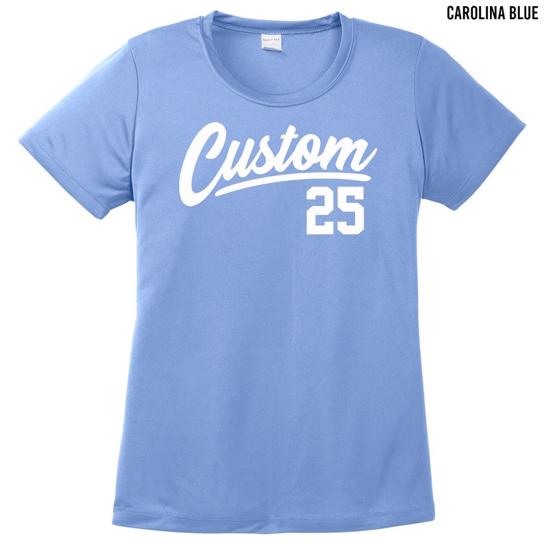 May include: A light blue t-shirt with a white custom design and the number 25. The text is in a bold, cursive font.