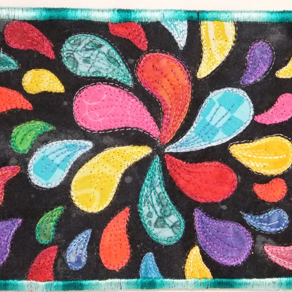 Fiber art quilted Postcard, Multi color droplets on black background.