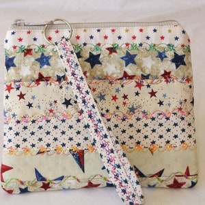 Quilted Wristlet in a variety of stars on beige fabrics with decorative stitching. Patriotic  Wristlet is 6.5&quot;W x 5.5&quot;H and 6&quot; wrist strap.